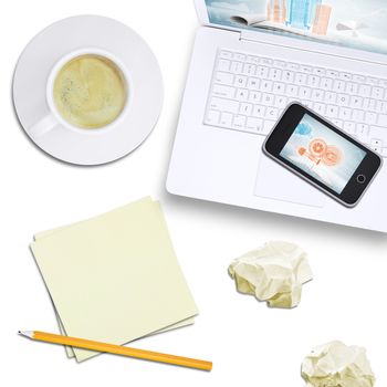 Mobile phone on laptop with tablet, note paper and coffee on isolated white background, top view