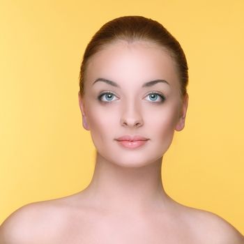 Beautiful girl on a yellow background