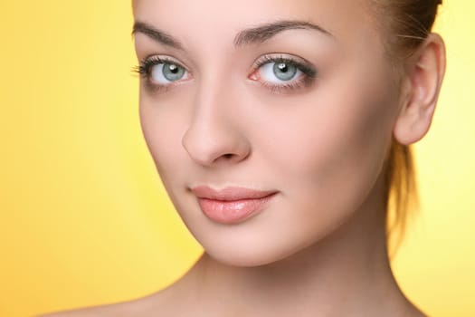 Beautiful girl on a yellow background