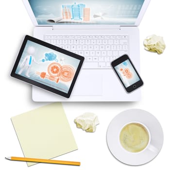 Tablet and mobile phone on laptop with coffee cup, crumpled paper on isolated white background, top view