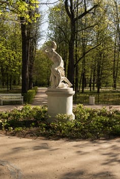 Warsaw.Poland.Lazienki(Bath) Royal Park.Sculpture "Tancred and Klorynda".The park is located round the square, up to which the star-shaped alley. In the middle of the square, the discount with flowers, on which stands an unusual sculpture. It is called "Tancred and Klorynda" and present heroes tragic love Torquato Tasso's poem "Jerusalem Delivered".Vertical View