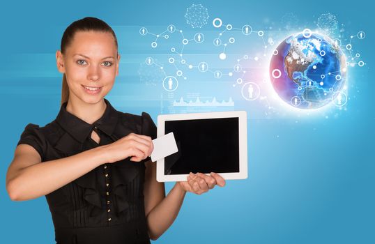 Smiling young woman in black dress holging tablet and blank card with 3d Earth model and looking at camera on abstract blue background. Elements of this image furnished by NASA