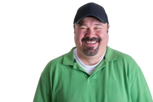 Portrait of Overweight Man Wearing Green Shirt and Black Baseball Cap Laughing in front of White Background, Head and Shoulders Portrait of Joyful Man