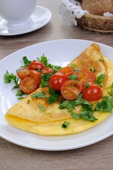 Omelette tomatoes and herbs, coffee with fresh pastries