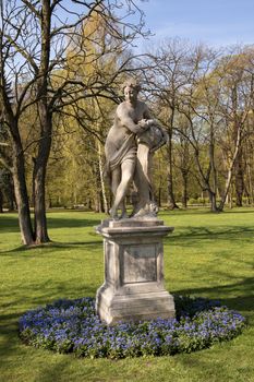 Poland.Warsaw.Sculpture 'Dawn" in Lazienki9Bath)Royal Park.In the southern part there is a marble sculpture Baths - the work of Sophie Trzcińska-Kaminska. It shows Jutrzenka portrayed here as a naked young girl.Photo was taken in April 2015.Vertical view