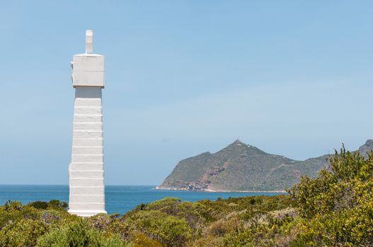 Monument near Cape Point (visible in back) commemorate voyage around the Cape by Vasco da Gama in 1497. Serves as beacon helping ships avoid Whittle Rock