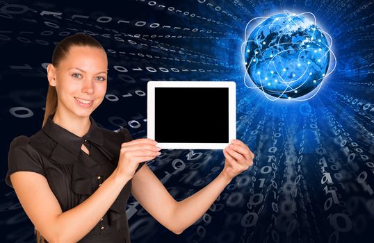 Smiling young woman holging tablet with blank screen and looking at camera blue background. Connection all over the world. Elements of this image furnished by NASA