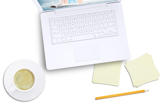 White laptop and coffee cup on isolated white background, top view. Closed up