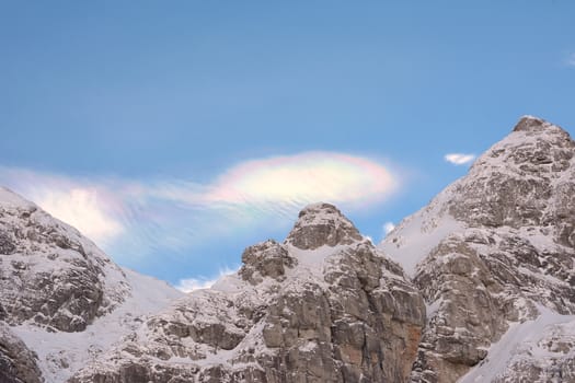 colored cloud over the mountain ridge, rare phenomenon 