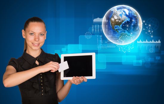 Smiling young woman holging tablet and blank card with 3d Earth model and looking at camera on abstract blue background. Elements of this image furnished by NASA