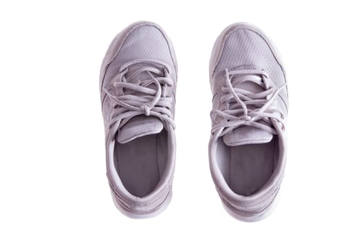 High Angle View of Pair of Worn White Sneakers or Running Shoes with Tied Laces on White Background