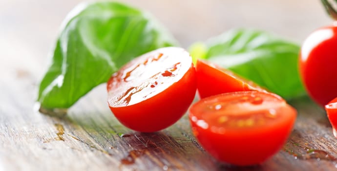 Tomatoes and basil leaf macro