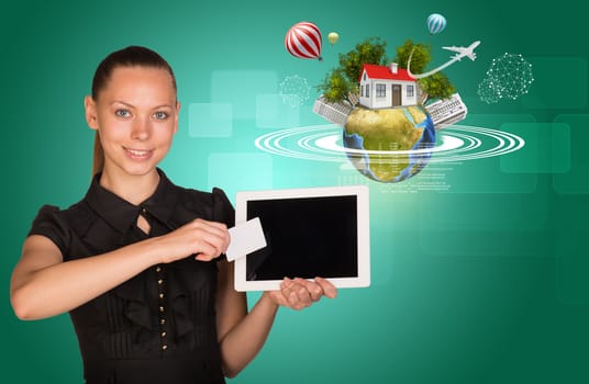 Businesslady holging tablet and blank card with 3d Earth model with circles, trees, house, buildings around and looking at camera on abstract green background. Elements of this image furnished by NASA