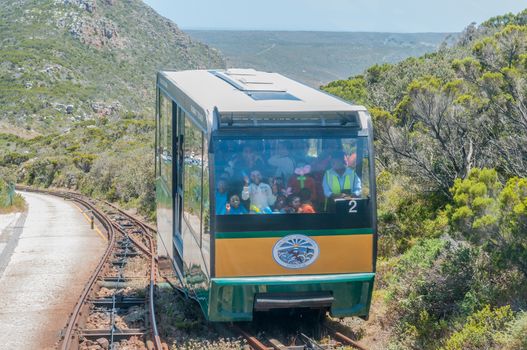 CAPE TOWN, SOUTH AFRICA - DECEMBER 12, 2014: The up and down funiculars at Cape Point about to pass each other