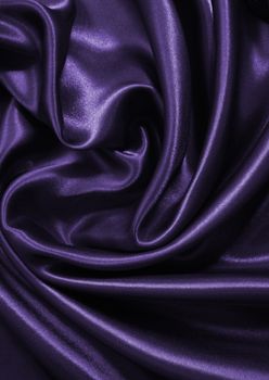 Smooth elegant lilac silk or satin as background 