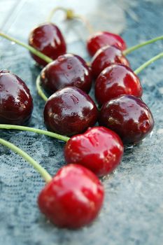 picture of a cherry berries on a wet surface