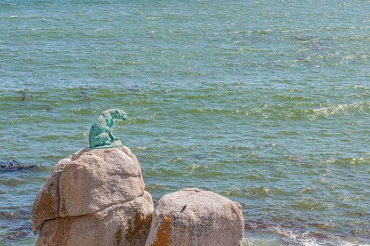 CAPE TOWN, SOUTH AFRICA - DECEMBER 12, 2014:  The bronze leopard of Hout Bay was sculptured by Ivan Milford-Barberton in 1963 as a memorial to the many wild animals that once roamed the mountains