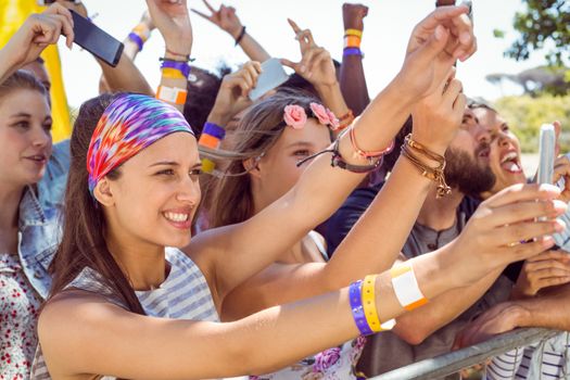 Excited music fans up the front at a music festival 