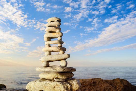 Balancing of stones each other on the seashore