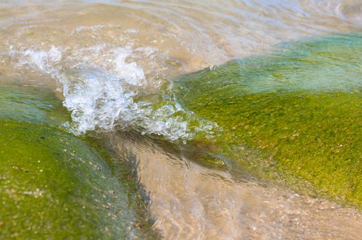 Rhythm of water wave hitting rocks at the beach