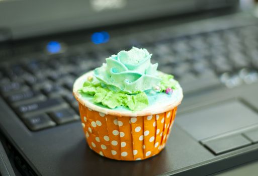 Green cream cupcake on Notebook