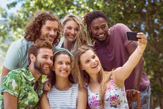 Happy friends taking a selfie on a summers day