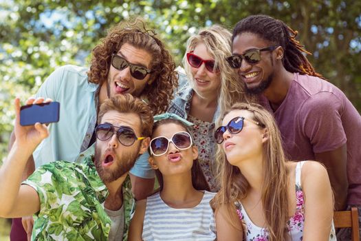 Happy friends taking a selfie on a summers day