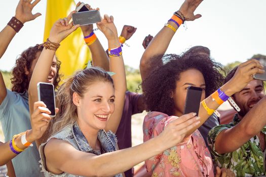 Excited music fans up the front at a music festival 