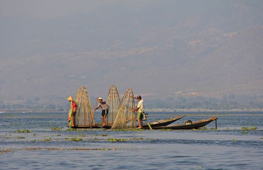 Men fishing on Inle Lake in Myanmar Feb 2015 No model release Editorial use only