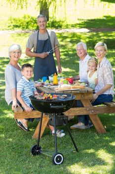 Happy family having picnic in the park on a sunny day