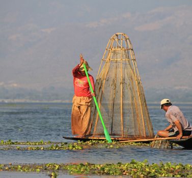 Men fishing on Inle Lake in Myanmar Feb 2015 No model release Editorial use only