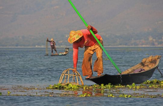 Men fishing on Inle Lake in Myanmar Feb 2015 No model release Editorial use only