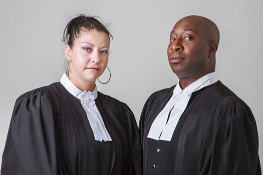 caucasion woman and black man wearing canadian lawyer toga