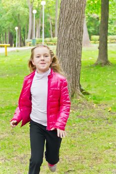 Photo of cute running girl in summer