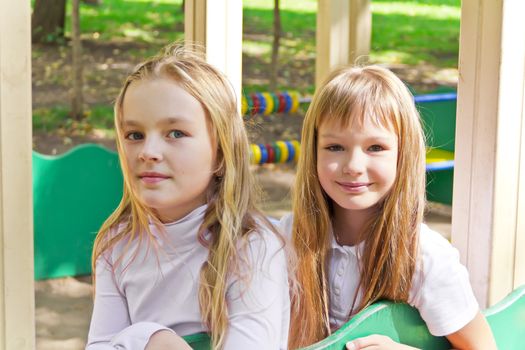 Photo of two cute girls with long hairs