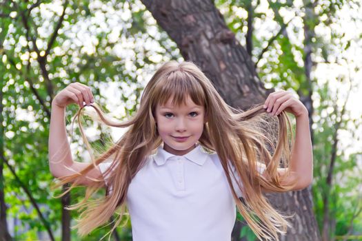 Photo of girl playing with long hair