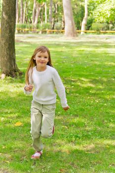 Photo of cute running girl in summer