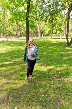 Photo of cute running girl in summer