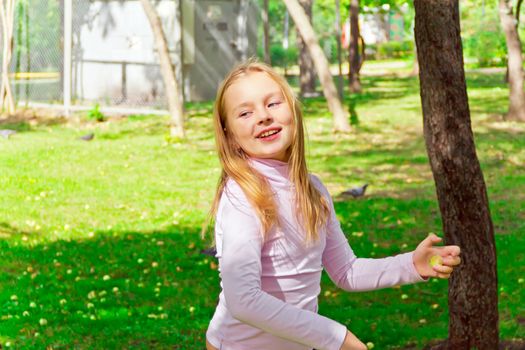 Photo of cute playing girl in summer