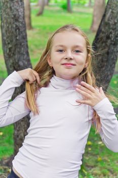 Photo of cute playing girl in summer