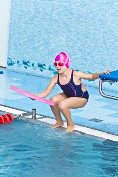 Photo of cute girl in swimming pool