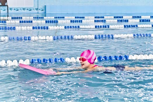 Photo of cute girl in swimming pool