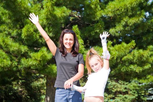 Photo of smiling mother and daughter in summer