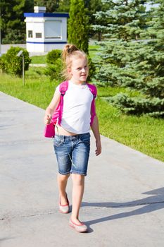 Cute girl go to school with pink knapsack