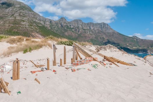 Old police station at Hout Bay reclaimed by sand dunes, Cape Town, South Africa.