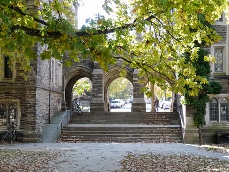 PRINCETON, NJ - OCTOBER 20: Colorful autumn in one of the best and oldest universities in USA, belonging to elite Ivy Leaque, classified at the 1-st place in ranking. Gates between Henry and Folke Halls in campus at Princeton University, October 20, 2013 in Princeton, NJ