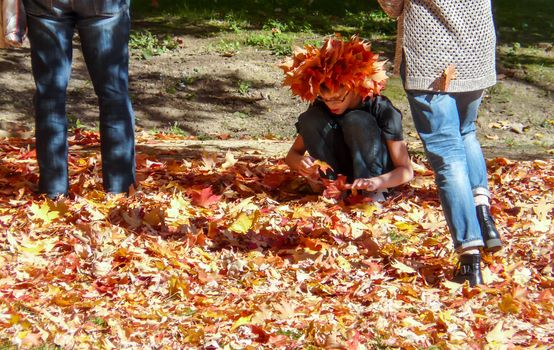PRINCETON, NJ - OCTOBER 20: Colorful autumn in one of the best and oldest universities in USA, belonging to elite Ivy Leaque, classified at the 1-st place in ranking. Girl with hat made of leaves, October 20, 2013 in Princeton, NJ
