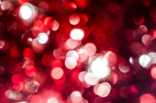 Red silver circle blur lights as christmas background.