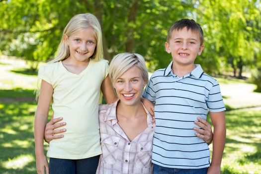 Pretty blonde with her children on a sunny day