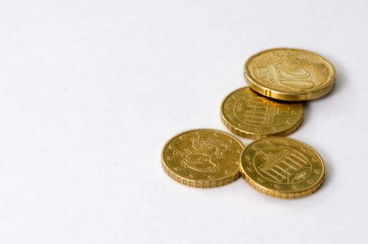 Four euro coins isolated on white background.